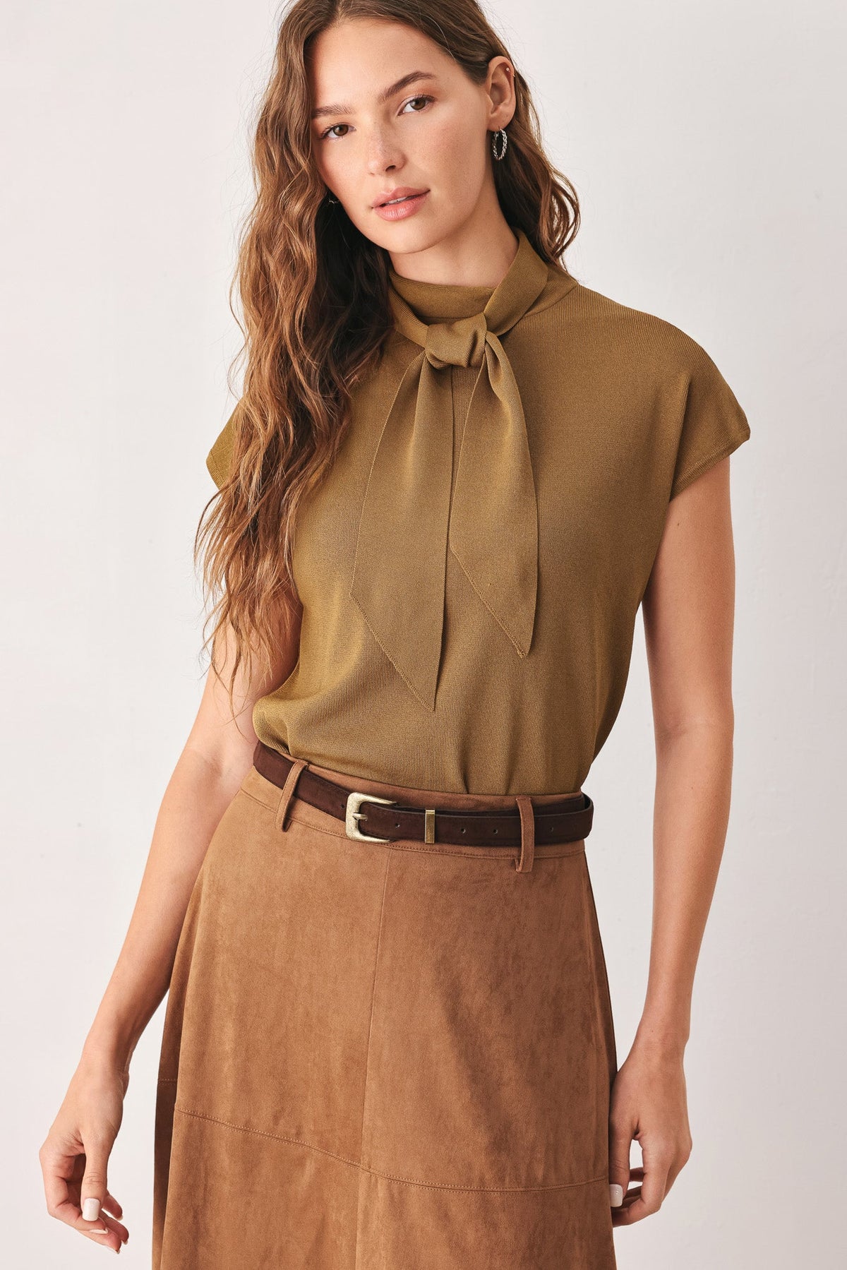 Amberglow sweater knit top styled with a skirt for office-to-evening dressing.