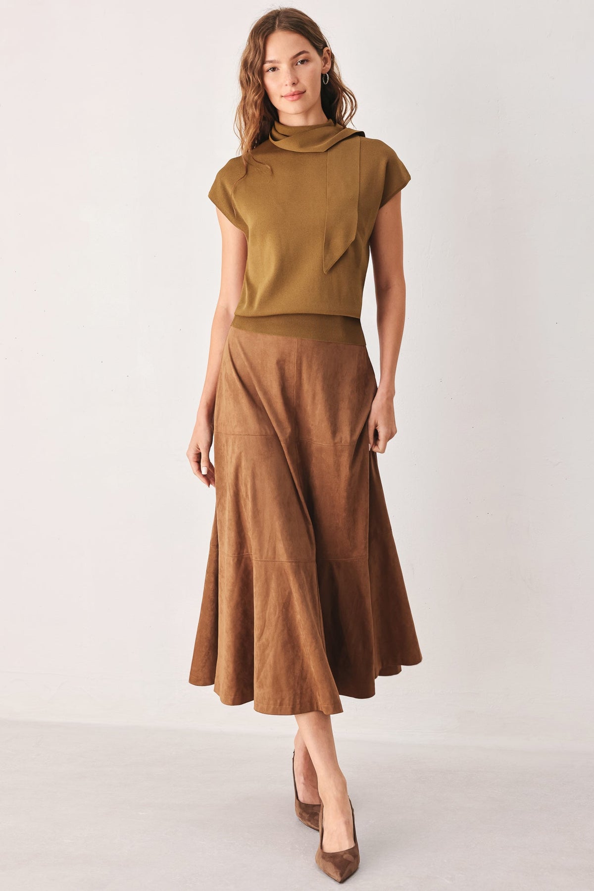 Scarf-neck sweater top with short cap sleeves, shown from the side.