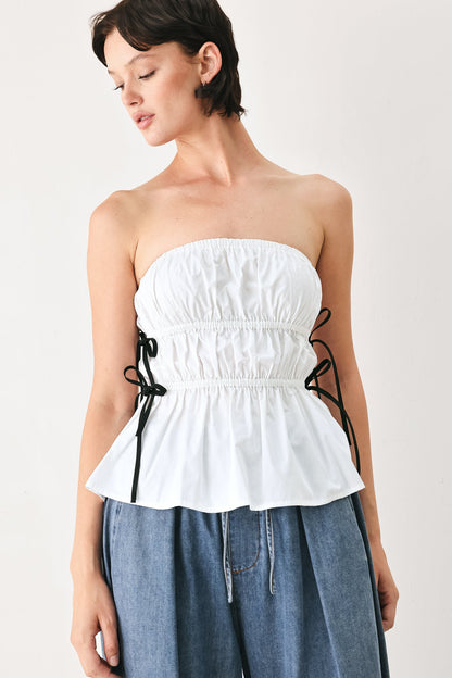 Flying Tomato Beach Club white woven strapless top with black ribbon bow ties.