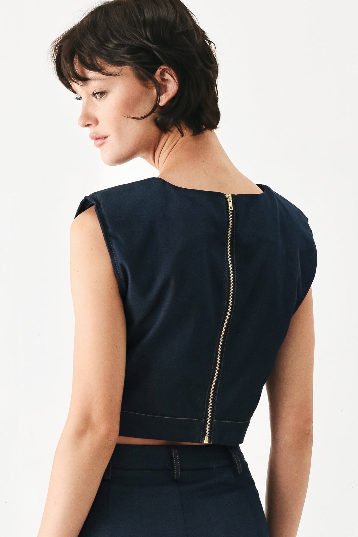 Fabric swatch showing the indigo cotton-polyester-spandex weave of the Yacht Club crop top.
