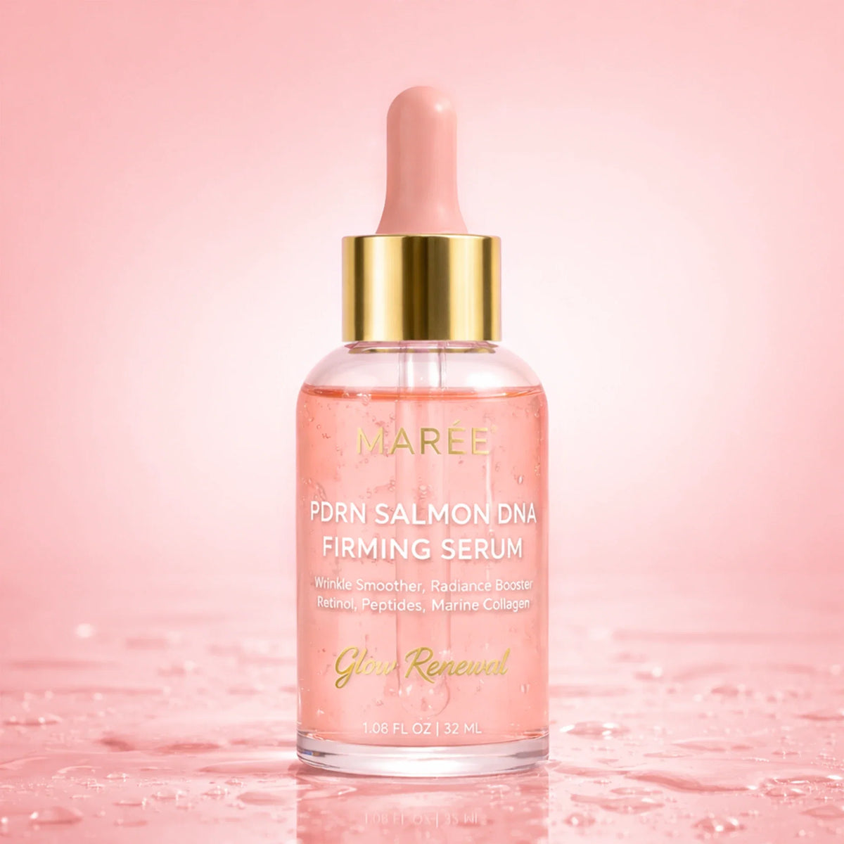 A bottle of MAREE PDRN Salmon DNA Firming Serum with a pink dropper cap and gold collar, set against a pink background with water droplets on the surface.