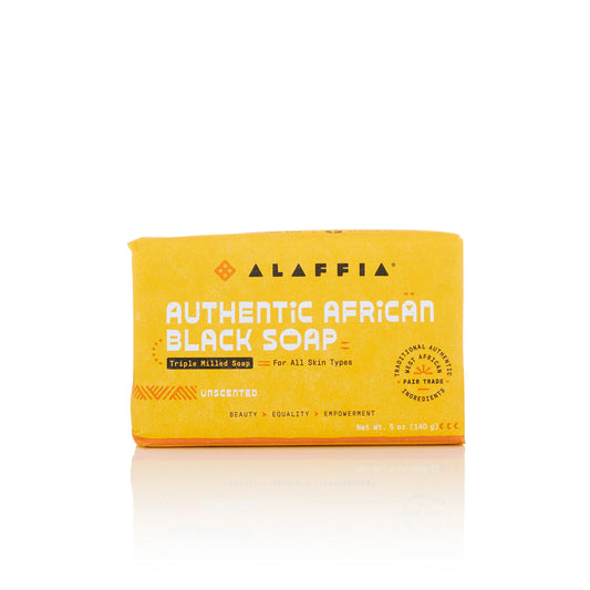 Alaffia Authentic African Black Soap bar on a white background