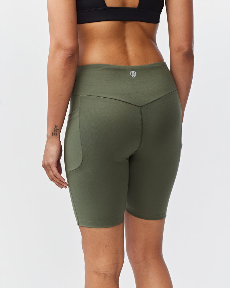 Go Again Bike Short 8" in Dark Moss, styled photo