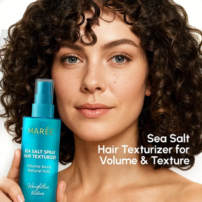 Woman holding a blue bottle of Maré Sea Salt Spray Hair Texturizer with text on a white background