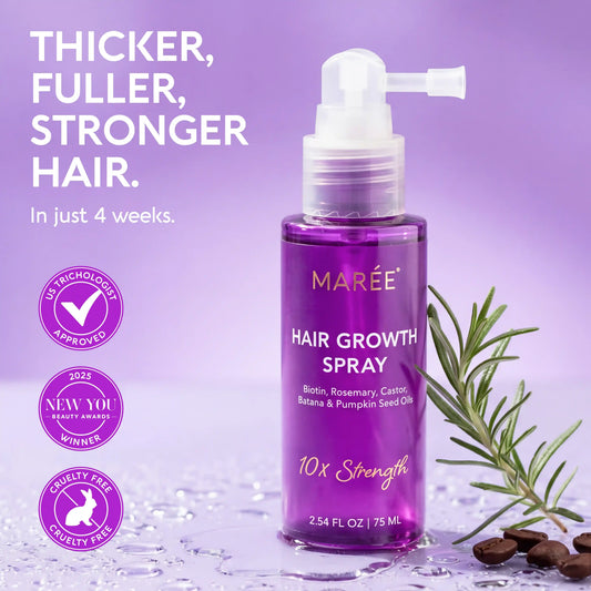 A bottle of MARÉE Hair Growth Spray in a rich purple shade, displayed on a reflective purple surface with water droplets, a rosemary sprig, and coffee beans. The image includes promotional text on the left and award badges on the left-center.