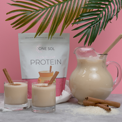 One Sol Protein package with a pitcher and glasses of protein shake on a pink background