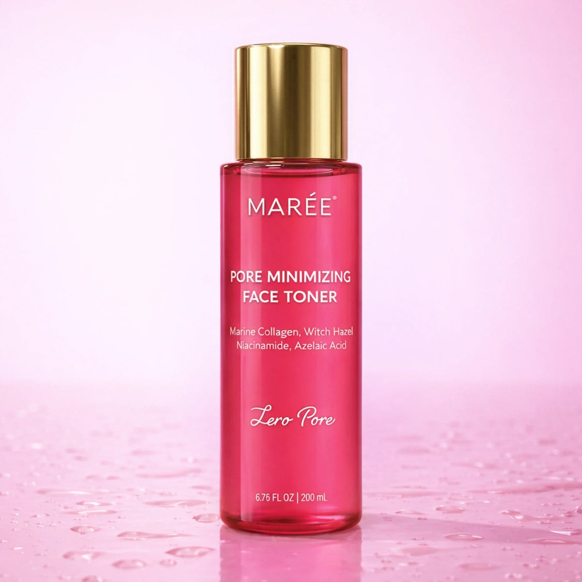 A bottle of MARÉE Pore Minimizing Face Toner with a shiny gold cap and pink liquid inside, set against a soft pink background with water droplets on the surface.