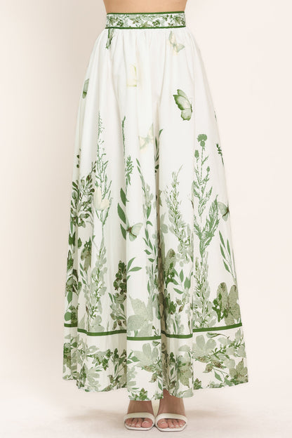 Ivory and sage floral print maxi skirt shown on a model against a plain studio background.