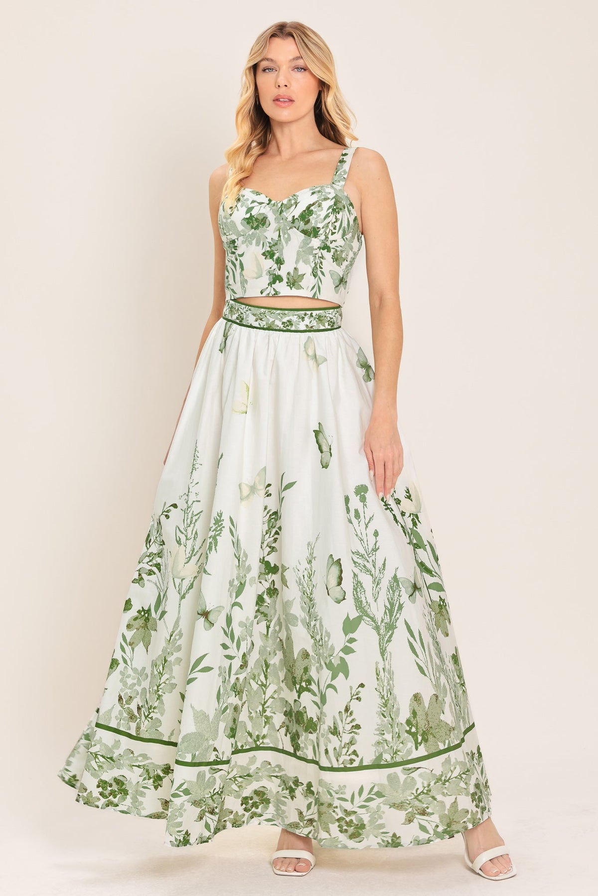 Floral maxi skirt in ivory and sage worn on a model in a light studio setting.