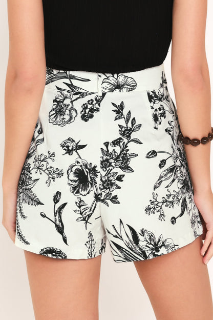 Floral shorts with black ink design on a white background