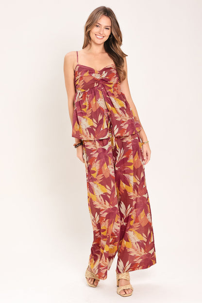 Full-length view of the burgundy floral wide-leg pants showing the flowing 42-inch leg.