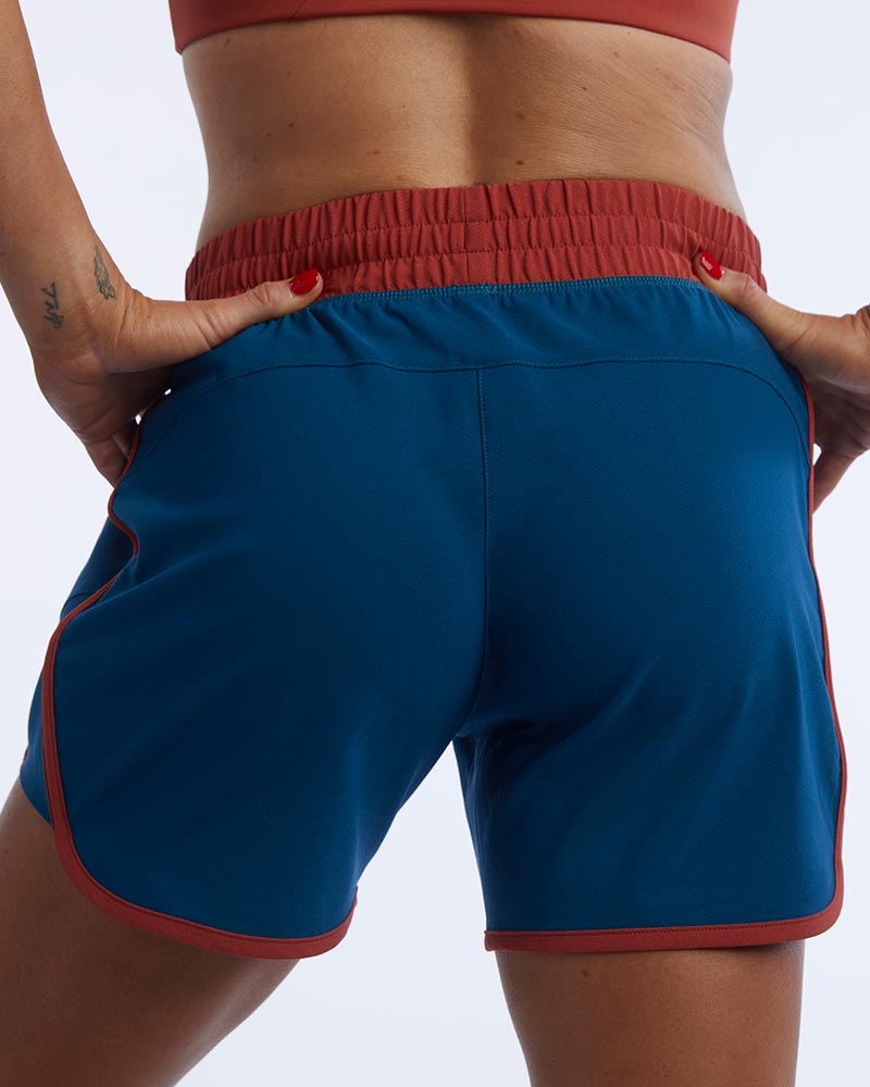 Indie Women's Sport Shorts in Dark Teal Cinnabar, back view