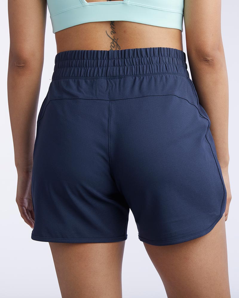 Indie Women's Sport Shorts in Navy, back view
