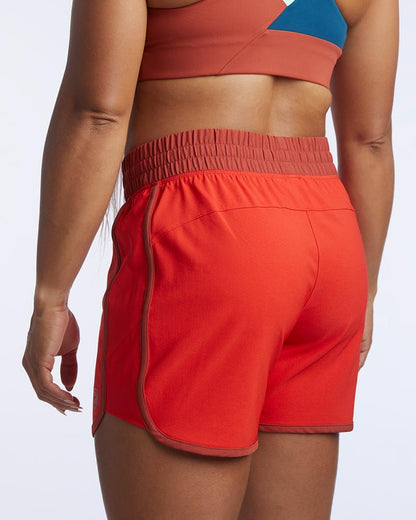 Indie Women's Sport Shorts in Poppy Cinnabar, back view