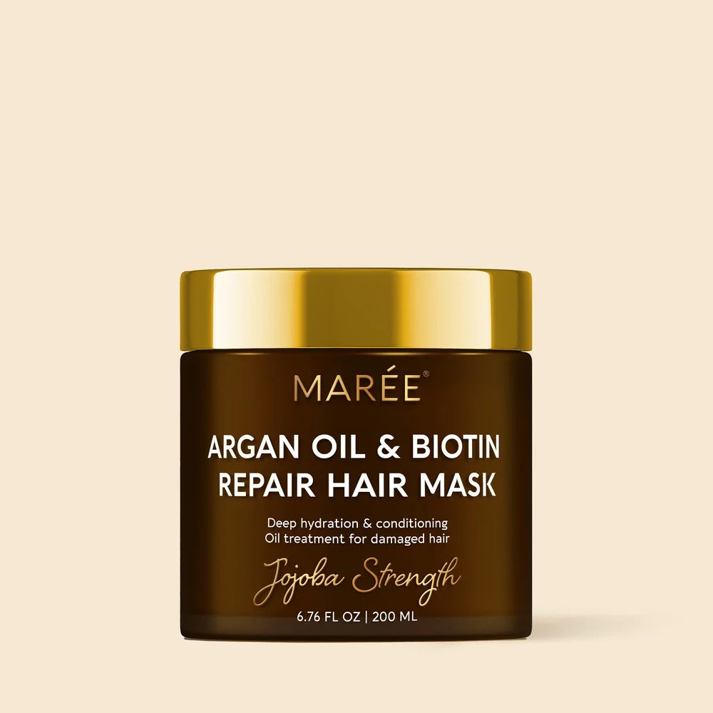 Maré Argan Oil & Biotin Repair Hair Mask jar on a beige background