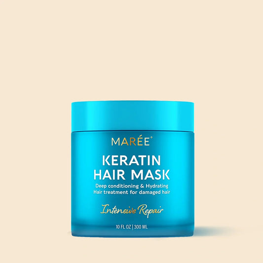 Blue jar of Marée Keratin Hair Mask on a beige background