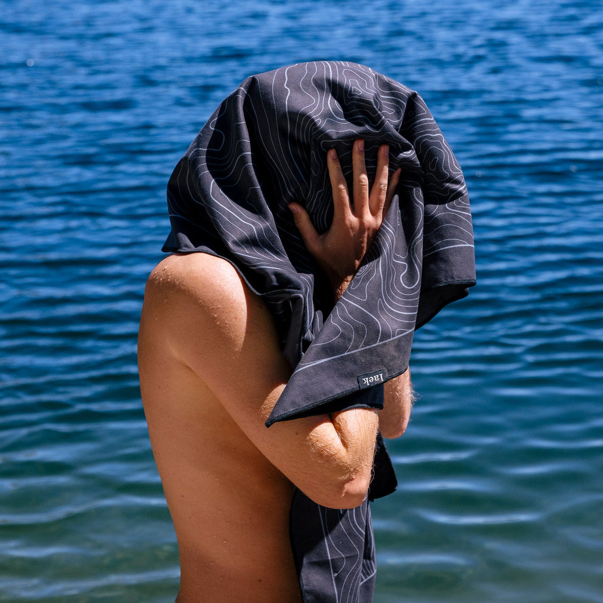 Laek Terrain Towel in Topo Black, shown used as a hair towel