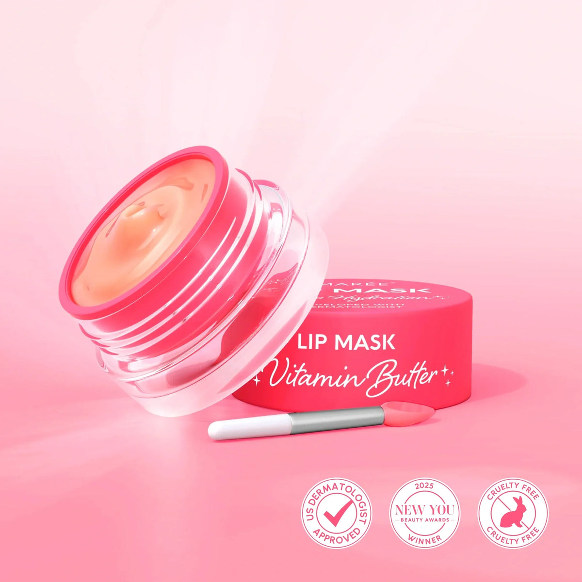 Lip mask with pink container and applicator on a pink background