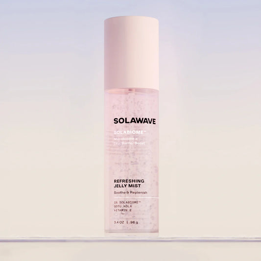 Solawave Solabiome Refreshing Jelly Mist bottle with a pale pink cap, centered against a soft light blue and white gradient background