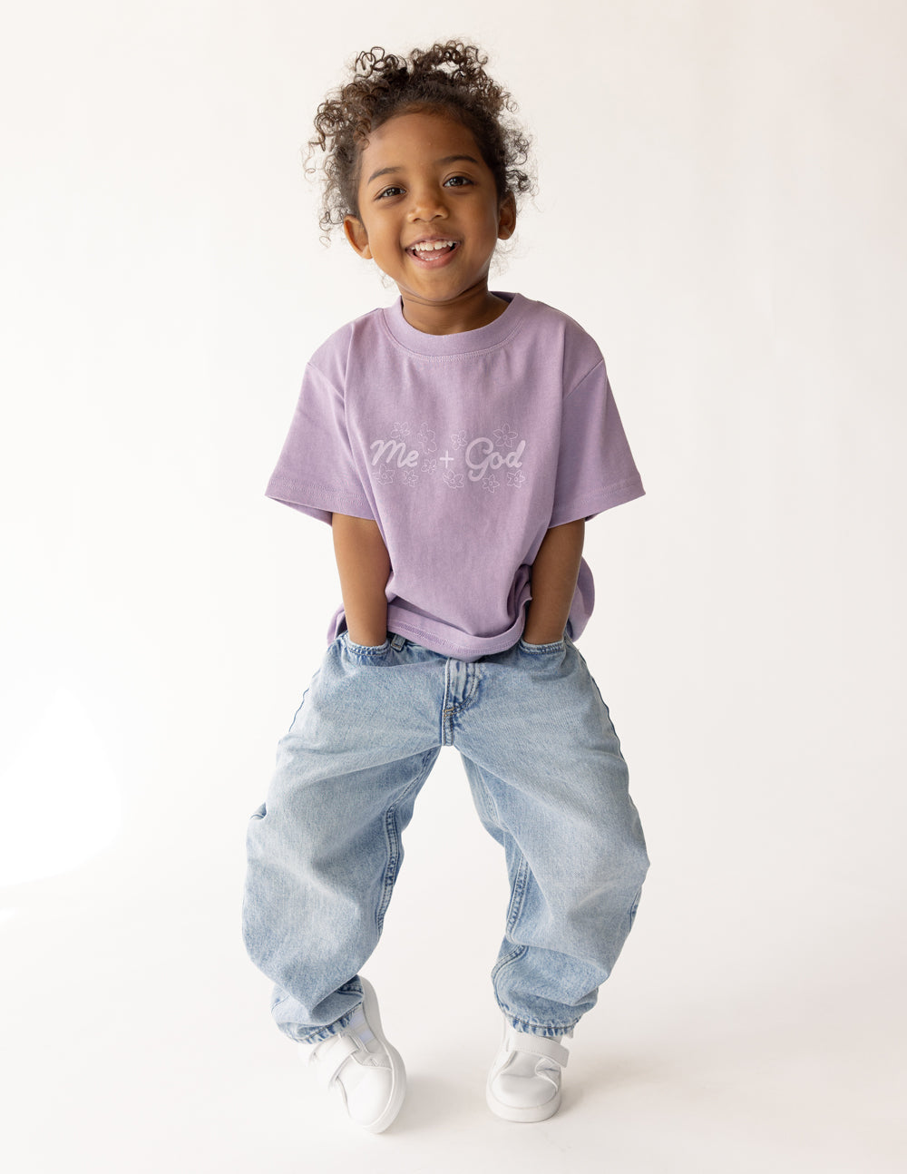 Me Plus God Kids Tee in Quiet Violet, styled photo