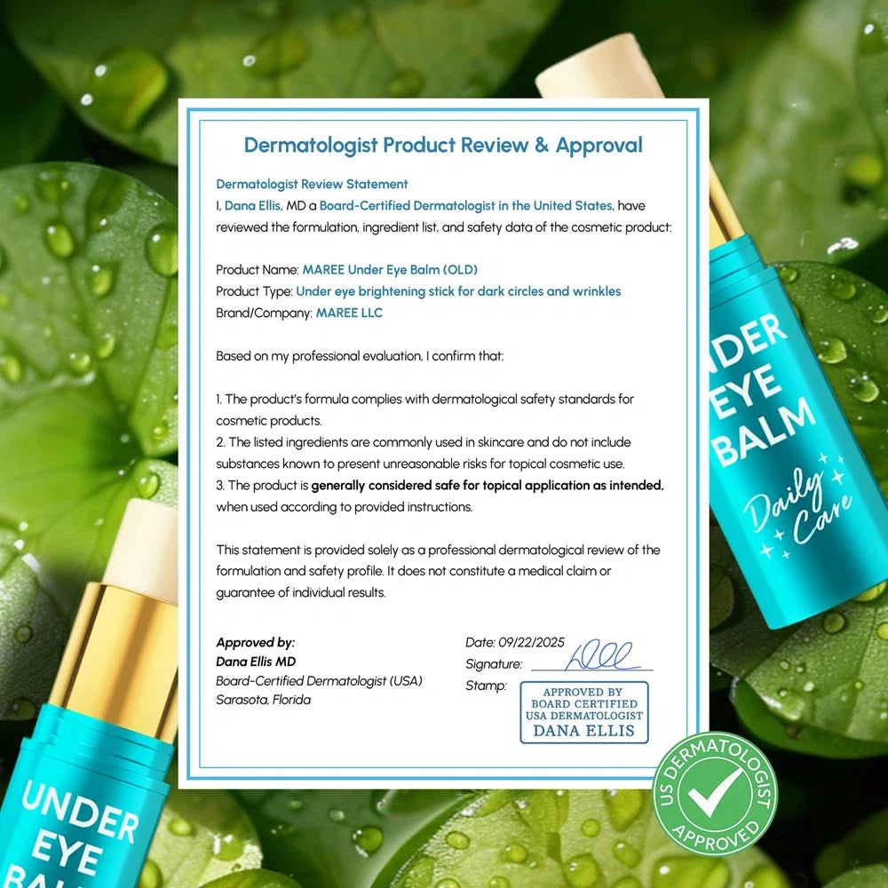 Under eye balm packaging with a dermatologist approval document on a green leaf background