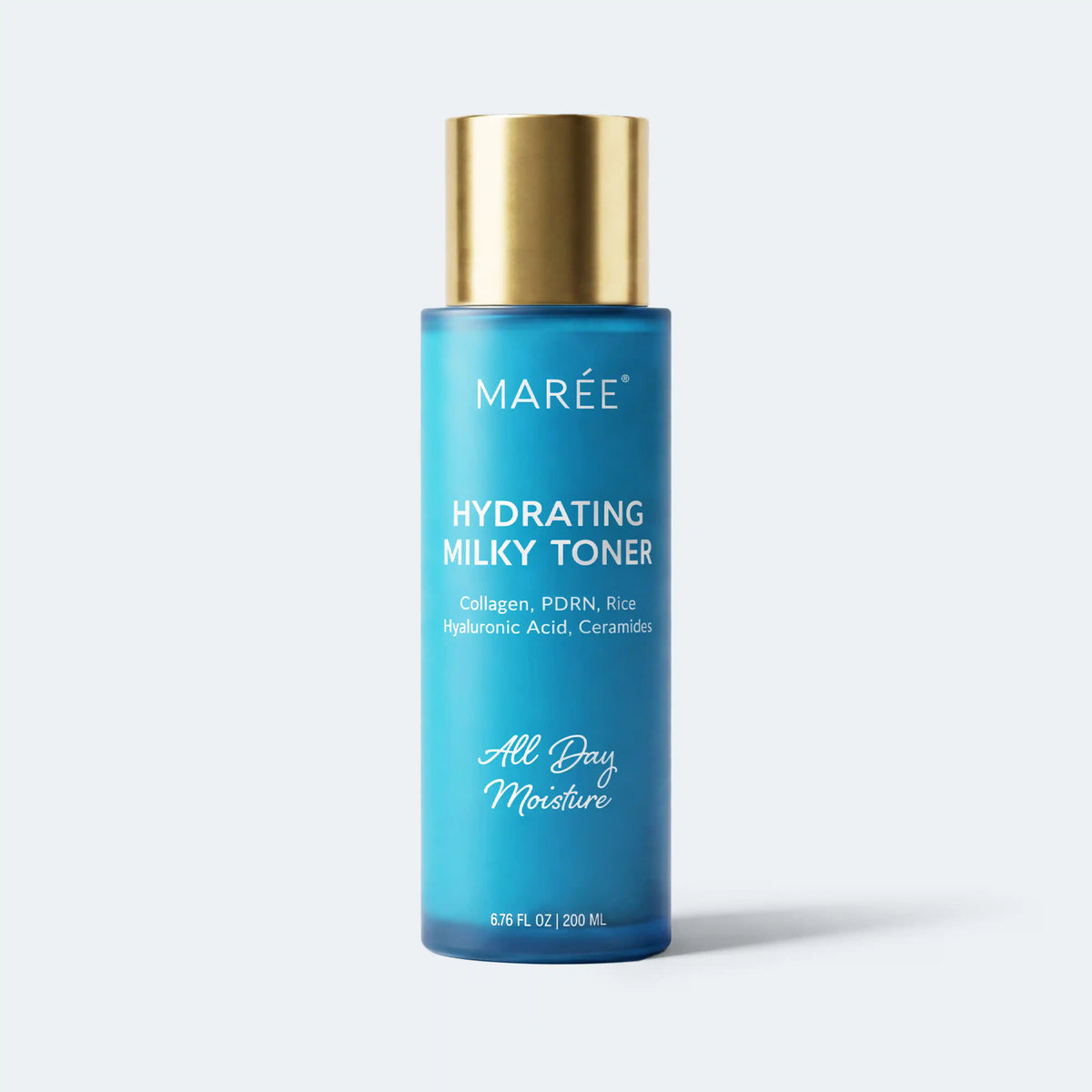 A bottle of MARÉE Hydrating Milky Toner with a metallic gold cap and a blue gradient bottle, centered on a light gray background.