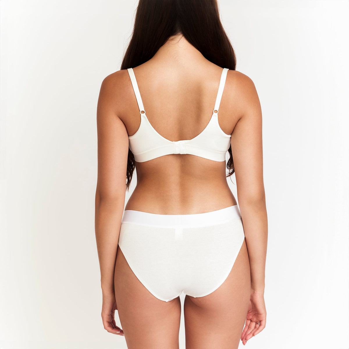 Botanical Dye Mid-Rise Brief in Milk, worn on model against a plain background