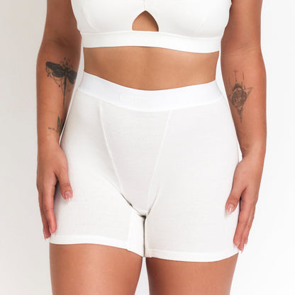 Botanical Dye Boxer in Milk, worn on model against a plain background