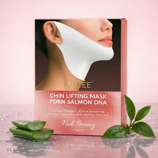 Maree Chin Lifting Mask packaging box displayed on a reflective surface with a pink background, alongside aloe vera slices and green leaves. The box features a model wearing the white chin lifting mask.