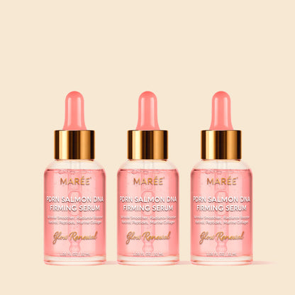 Three bottles of Maree Prawn Salmon DNA Firming Serum on a beige background