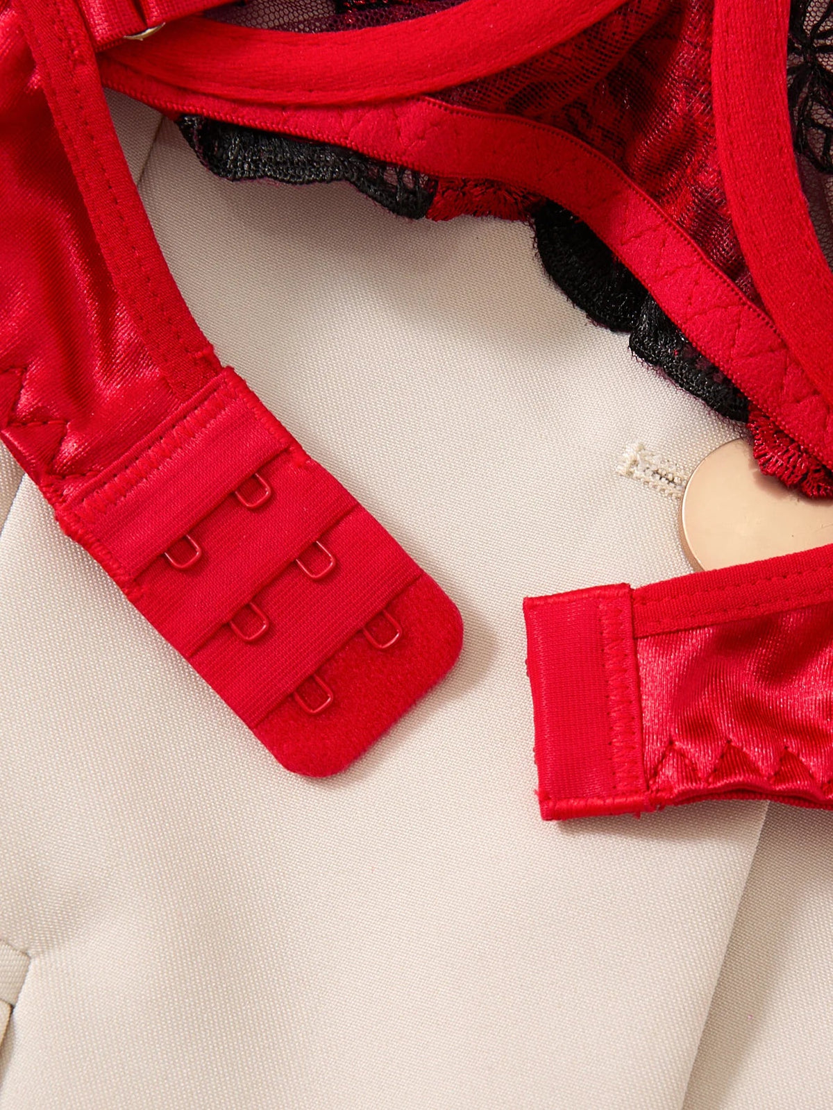 Red lingerie set with a beige background