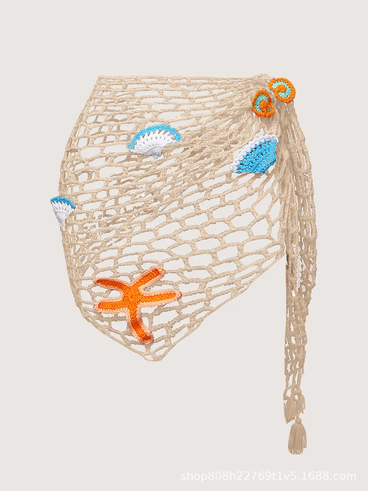 Beige crochet bag with starfish and shell decorations on a light gray background