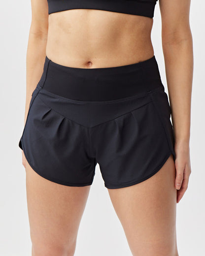 Sheva Women's High Rise Running Shorts in Black, styled photo