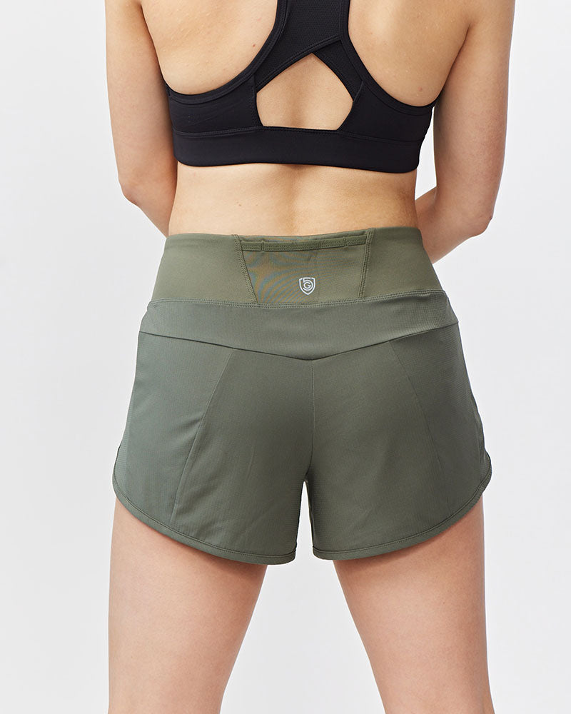 Sheva Women's High Rise Running Shorts in Dark Moss, back view