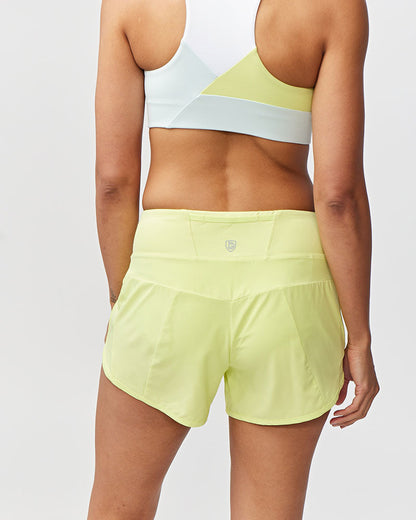 Sheva Women's High Rise Running Shorts in Limelight, back view