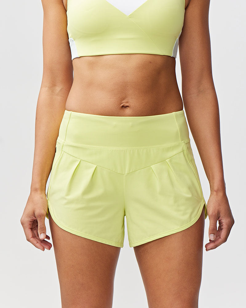 Sheva Women's High Rise Running Shorts in Limelight, front view