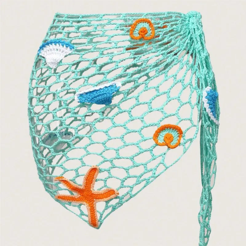 Net bag with crochet accents featuring starfish and seashell patterns on a light background