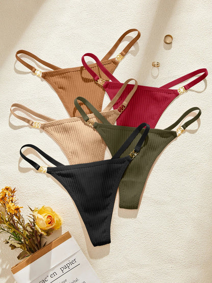 Four ribbed bikini bottoms in black, green, beige, and red on a light background.