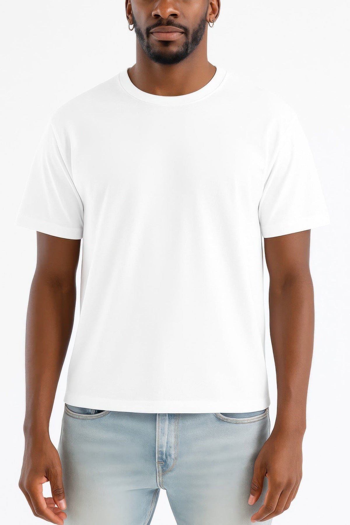 Man wearing a plain white t-shirt and light blue jeans on a white background