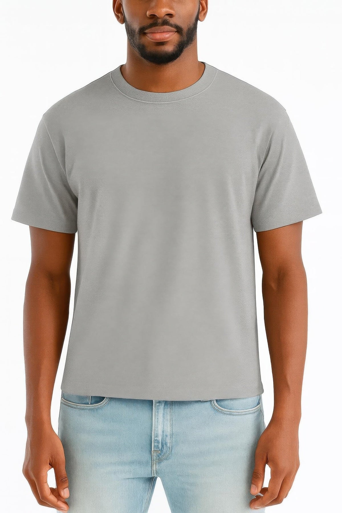 A man wearing a plain light gray crew-neck t-shirt and light blue jeans, shown from the chin down against a white studio background.
