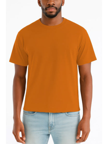 A man wearing a solid orange crew-neck t-shirt and light blue jeans, shown from the chin down against a plain white background.