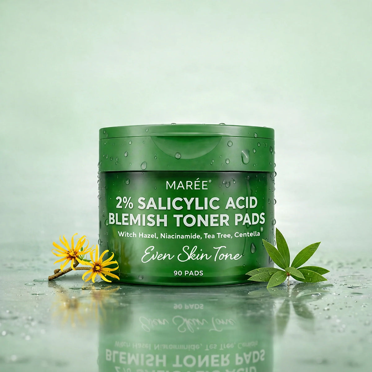 Green container of Maré 2% Salicylic Acid Blemish Toner Pads on a light green background with leaves and flowers.