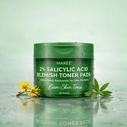 Green container of Maré 2% Salicylic Acid Blemish Toner Pads on a light green background with leaves and flowers.
