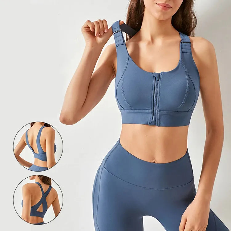 A woman modeling a slate blue athletic sports bra with a front zipper and wide shoulder straps, paired with matching high-waisted leggings. Two circular inset images on the left show the back views of the bra and leggings.