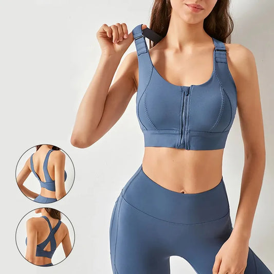 A woman modeling a slate blue athletic sports bra with a front zipper and wide shoulder straps, paired with matching high-waisted leggings. Two circular inset images on the left show the back views of the bra and leggings.
