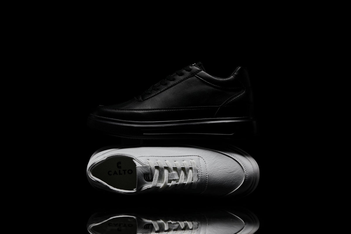 Black leather shoe with 'Caliro' branding on a black background