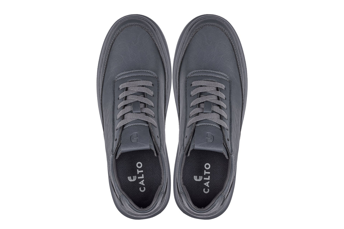 Pair of gray sneakers with 'Calto' branding on a white background