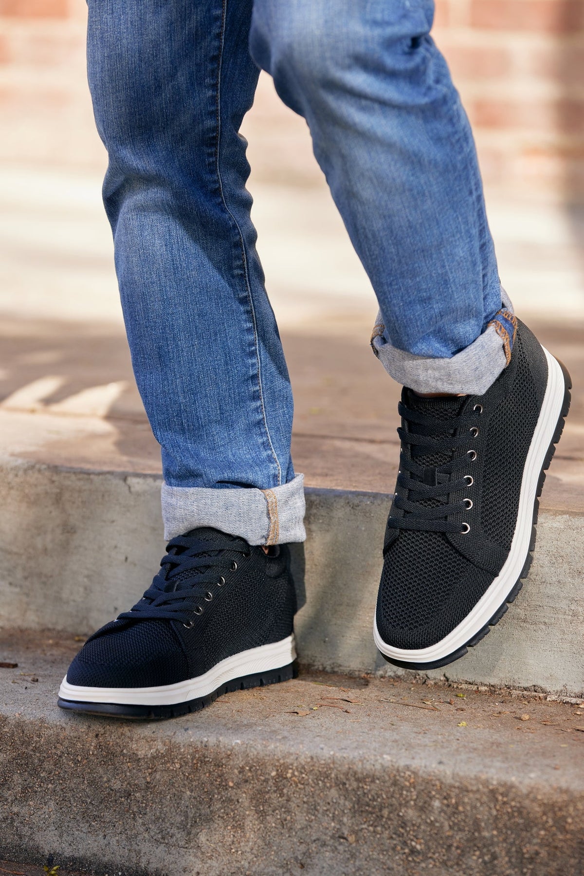CALTO X2322 knit elevator sneaker in black and white, first styled product photo