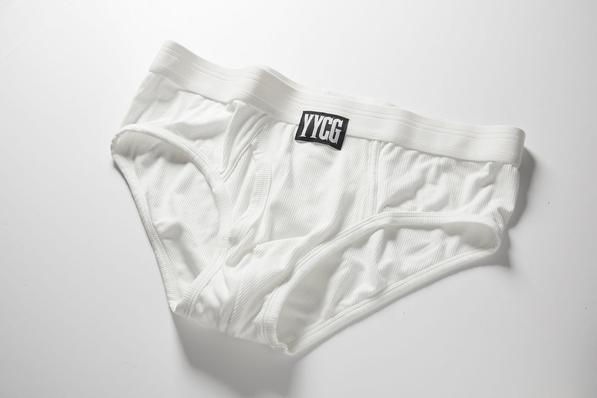 White men's underwear with a visible brand logo on a light gray background
