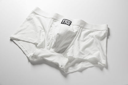 White boxer briefs with a brand label on a light gray background